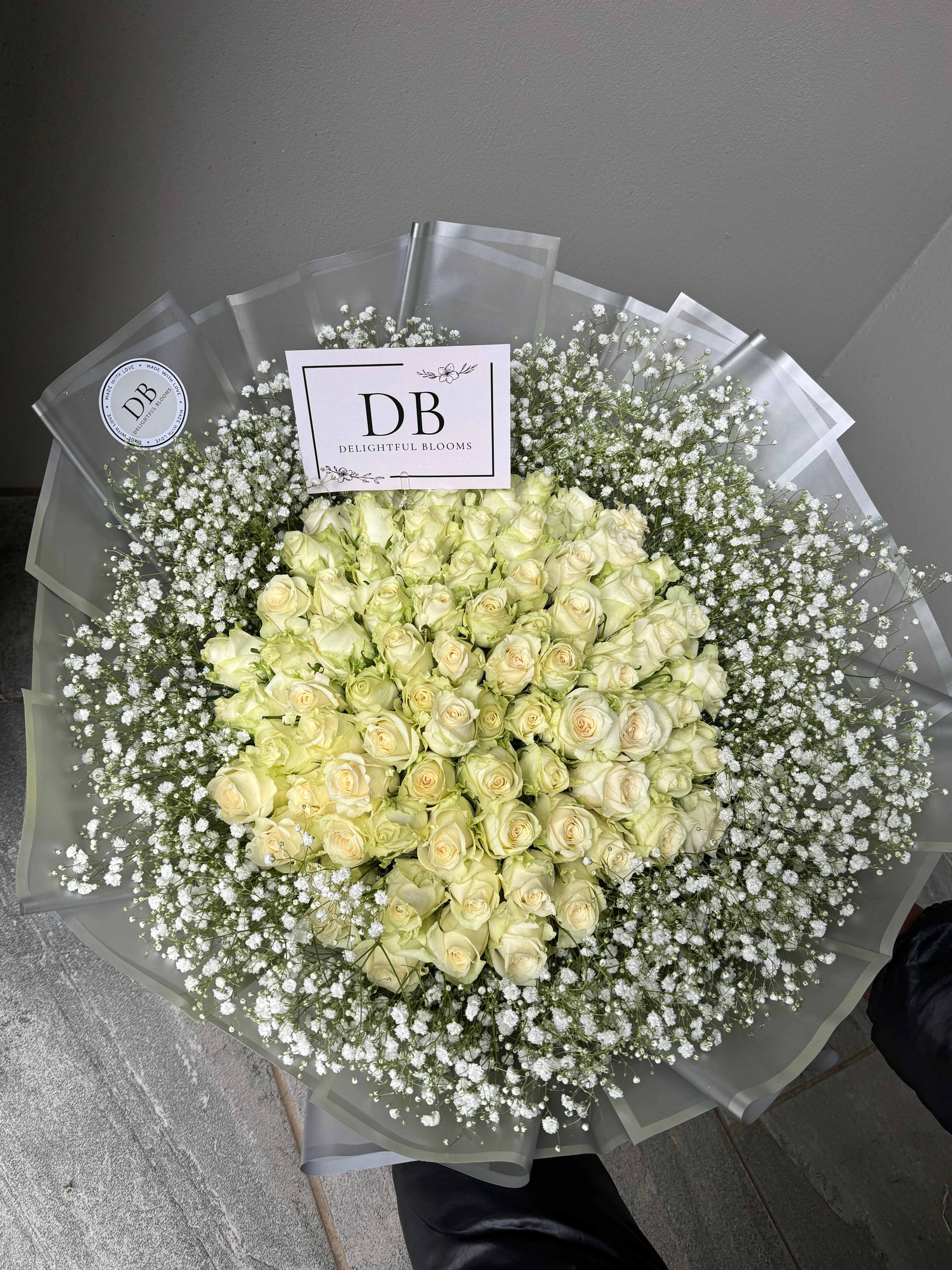 100 White Roses with baby’s breath bouquet