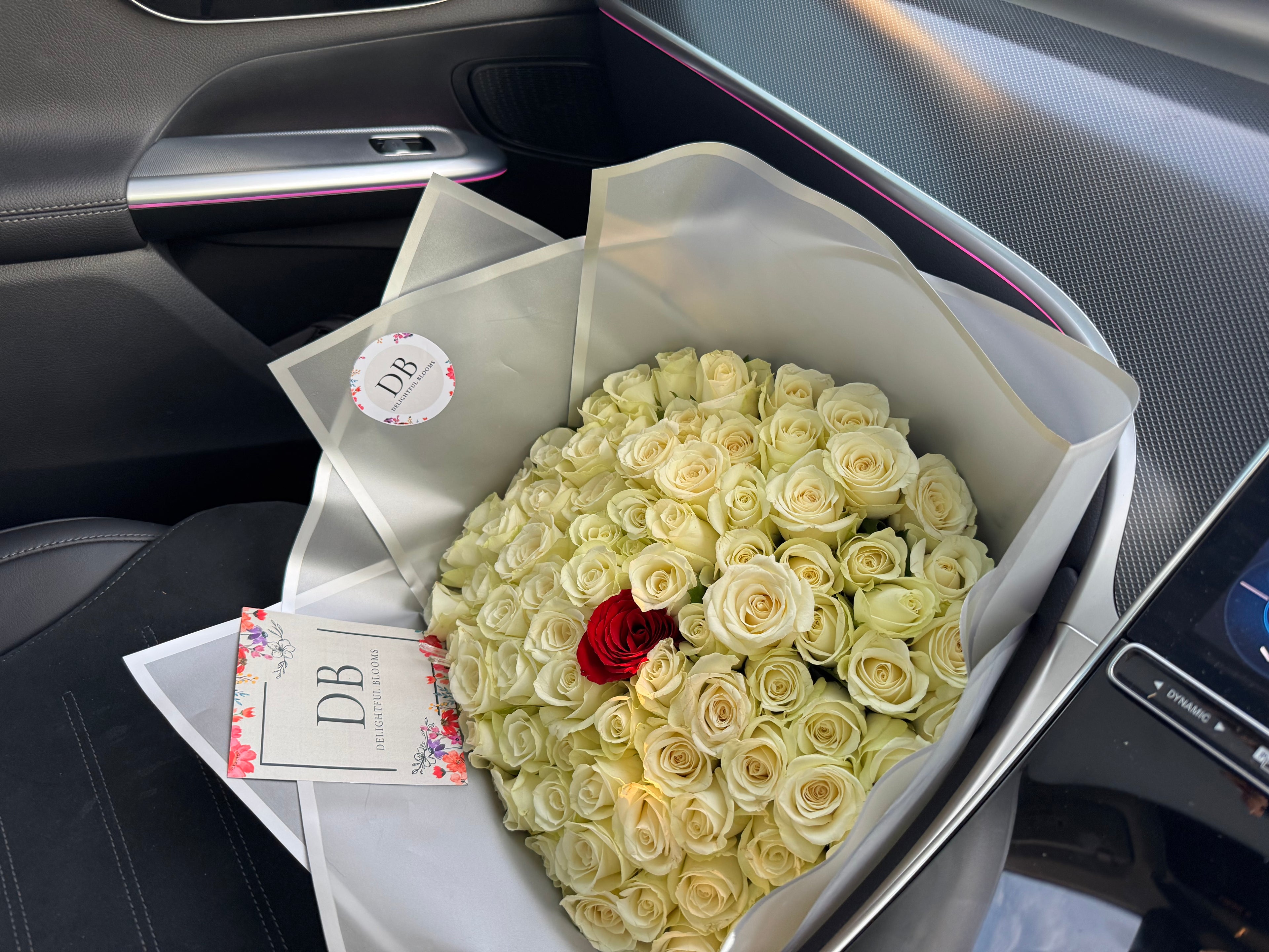 100 White Roses with single Red Rose